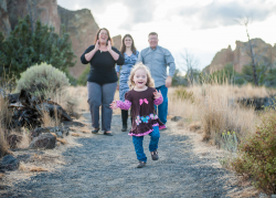 Happy hiking family photo on desert path