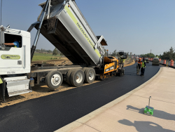 Paving the Powell Butte Highway/Butler Market Road roundabout, July 2024
