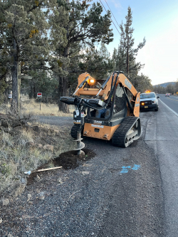 Crews installing new traffic control signs on Old Bend - Redmond Highway